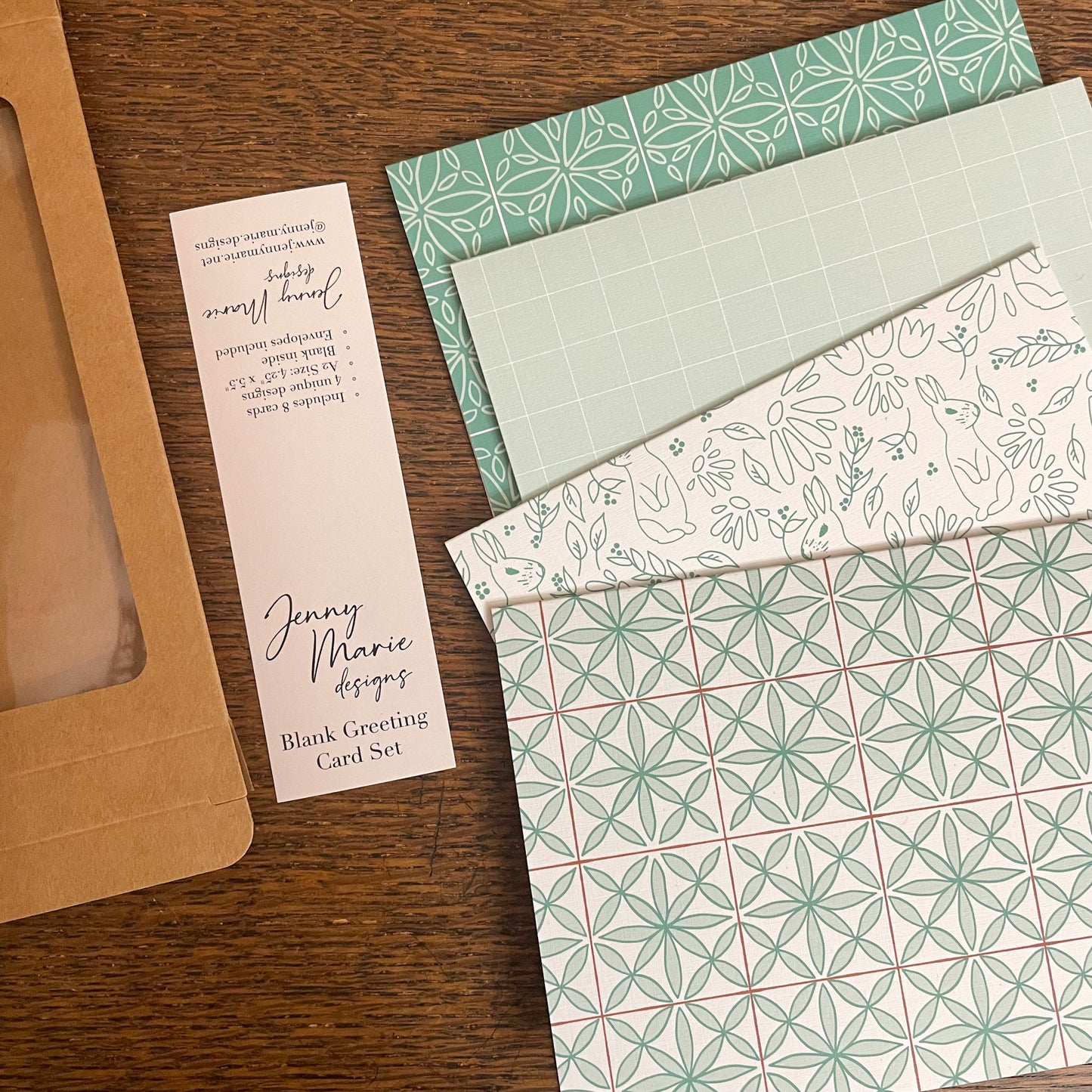 Behind the scenes photo of greeting card set being assembled for retail packaging.